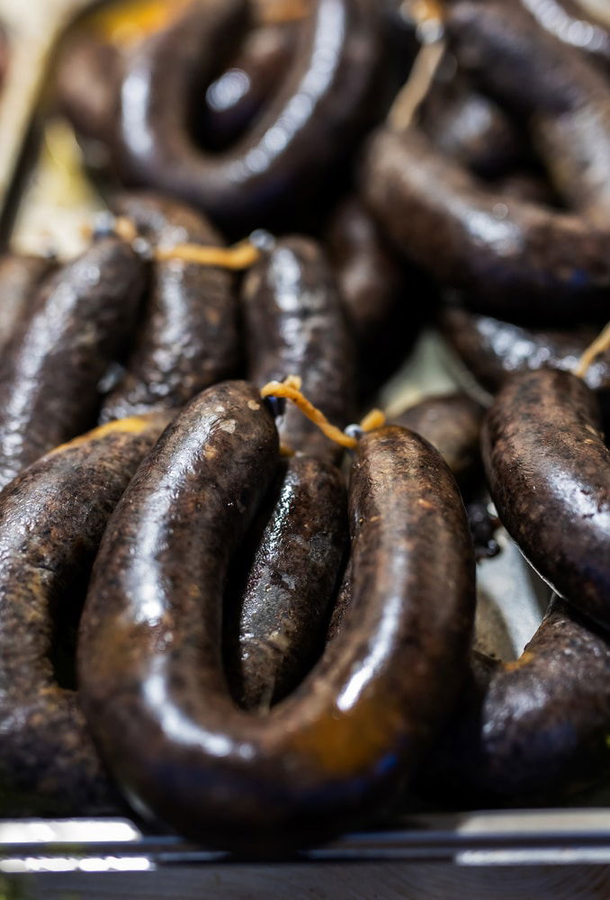 A close-up of Krvavice (Bloody Sausages) on a tray.